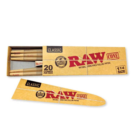 Angled overhead view of the RAW Classic 1 1/4 Pre-Rolled Cones 20-Pack box in natural brown. Showcasing the slide-out tray opened, this 20-count package provides frequent smokers with an ample supply of ready-to-fill unbleached classic cones.