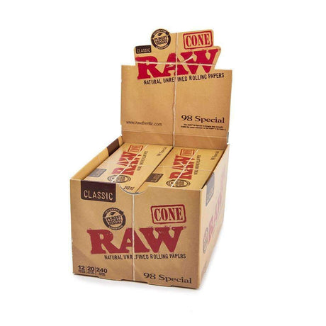 Angled overhead view of the RAW Classic 98 Special Cones packaging in natural brown. Showcasing the display box opened, these ready-to-fill cones provide frequent smokers with a convenient, clean, and slow-burning experience.