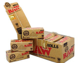 Front angled view of the RAW Classic King Size 3-Meter Rolls 12-count display box in natural kraft brown packaging with red branding. This retail-ready carton provides smoke shops with an attractive countertop presentation for these customizable, unbleached rolling papers.
