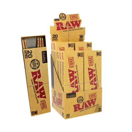 Angled overhead view of the RAW Classic King Size Pre-Rolled Cones 20-Pack box in natural brown. Showcasing the slide-out box opened, this 20-count package provides frequent smokers with an ample supply of ready-to-fill unbleached classic cones.