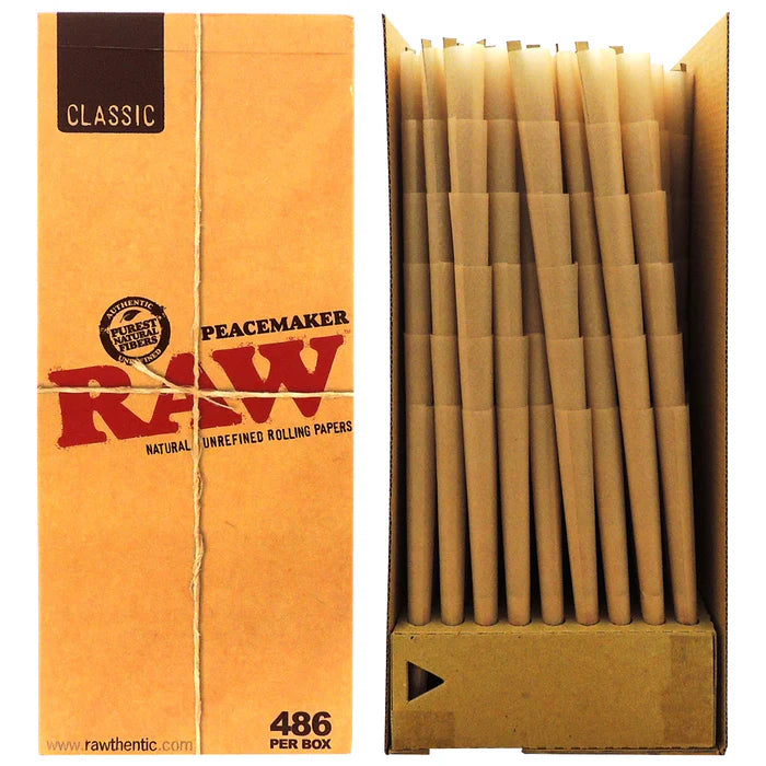Angled overhead view of the RAW Classic Peacemaker Bulk Cones box in natural brown. Showcasing the bulk packaging opened to reveal the neatly stacked layers of pre-rolls, this 486-count case is perfectly organized for high-volume commercial filling operations.