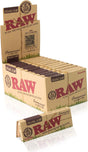 Front angled view of the RAW Connoisseur Organic Hemp 1 1/4 papers and tips 24-count display box in natural light brown with green and red accents. This retail-ready counter display box neatly showcases these convenience-focused rolling kits to boost impulse purchasing at checkouts.