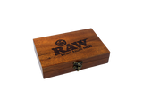 Top down view of the RAW double six dominoes set in a natural wood finish box featuring the classic red RAW logo. This 28-piece premium game set comes in a durable storage case, making it the perfect collectible accessory for game nights and smoke sessions.