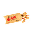Close-up angled view of a small cluster of loose RAW Pre-Rolled Wide Tips in natural light brown. These chemical-free, perfectly rolled wide-profile filters prevent loose material from passing through while providing a larger distance to cool down smoke.