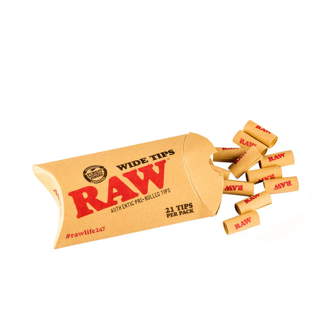 Close-up angled view of a small cluster of loose RAW Pre-Rolled Wide Tips in natural light brown. These chemical-free, perfectly rolled wide-profile filters prevent loose material from passing through while providing a larger distance to cool down smoke.