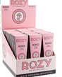 Front angled view of the Rozy Pink Pre-Rolled Cones King Size 24-pack display carton in a vibrant pink. These mechanically dyed European paper wraps hold approximately 1.25 grams of unrefined botanical material and feature a pre-installed paper tip.