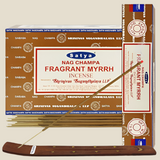 Front view of the Satya Incense 15g 12-Count Display box in the Fragrant Myrrh variant featuring deep orange highlights. This combustible agarbatti stick display unit is ideal for vertical counter placement to drive impulse checkout transactions.