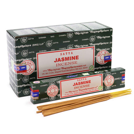 Front view of the Satya Incense 15g 12-Count Display box in the Jasmine variant featuring soft cream and yellow tones. This combustible agarbatti stick display unit is ideal for vertical counter placement to drive impulse checkout transactions.