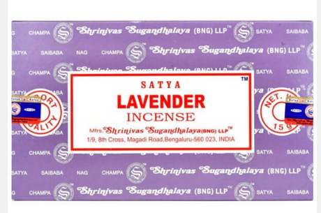 Front view of the Satya Incense 15g 12-Count Display box in the Lavender variant featuring soft purple color tones. This combustible agarbatti stick display unit is ideal for vertical counter placement to drive impulse checkout transactions.