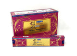 Front view of the Satya Incense 15g 12-Count Display box in the Natural Rose variant featuring red floral accents. This combustible agarbatti stick display unit is ideal for vertical counter placement to drive impulse checkout transactions.