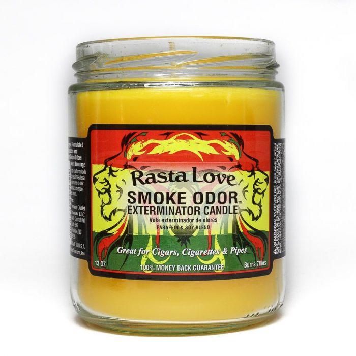 Front view of the Smoke Odor Exterminator Candle 13oz in a red, yellow, and green Rasta Love design. This enzyme-activated glass mason jar candle physically binds to and neutralizes airborne smoke and environmental smells