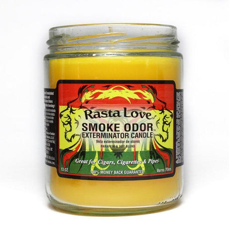 Front view of the Smoke Odor Exterminator Candle 13oz in a red, yellow, and green Rasta Love design. This enzyme-activated glass mason jar candle physically binds to and neutralizes airborne smoke and environmental smells