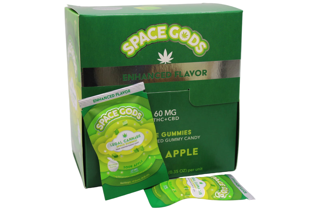 Angled overhead view of the Space Gods Delta 9 and CBD gummy retail display box in bright green and black. This wholesale bulk packaging is ideal for smoke shop countertops and effectively showcases the potent 60mg sour apple edibles to customers.