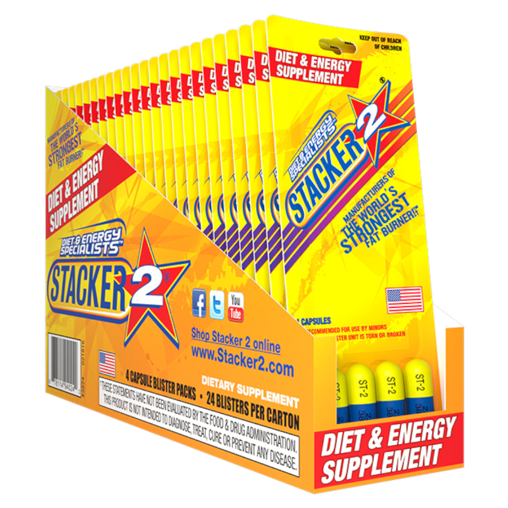 Front angled view of the Stacker 2 Ephedra Free Blaster Pack 24ct display box in vibrant yellow and red. This bulk wholesale counter box holds multiple blister cards of the classic energy supplement, making it a perfect high-margin impulse item for convenience store and smoke shop checkout counters.