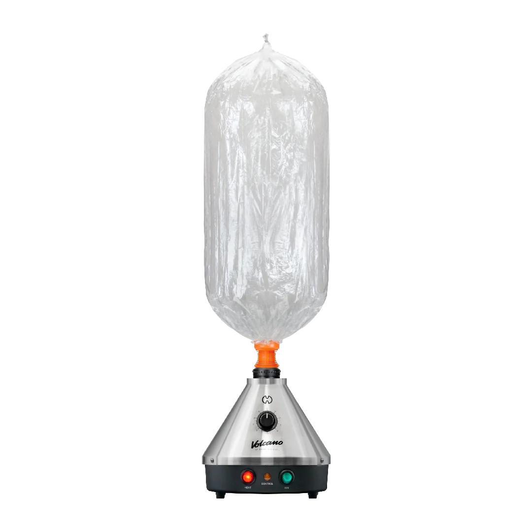 Front standing view of the Storz & Bickel Volcano Classic Onyx Edition in matte black with a clear Easy Valve balloon attached. The detachable balloon delivery system captures thick, pure vapor for smooth and convenient consumption anywhere in the room.