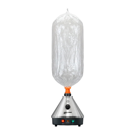 Front standing view of the Storz & Bickel Volcano Classic Onyx Edition in matte black with a clear Easy Valve balloon attached. The detachable balloon delivery system captures thick, pure vapor for smooth and convenient consumption anywhere in the room.