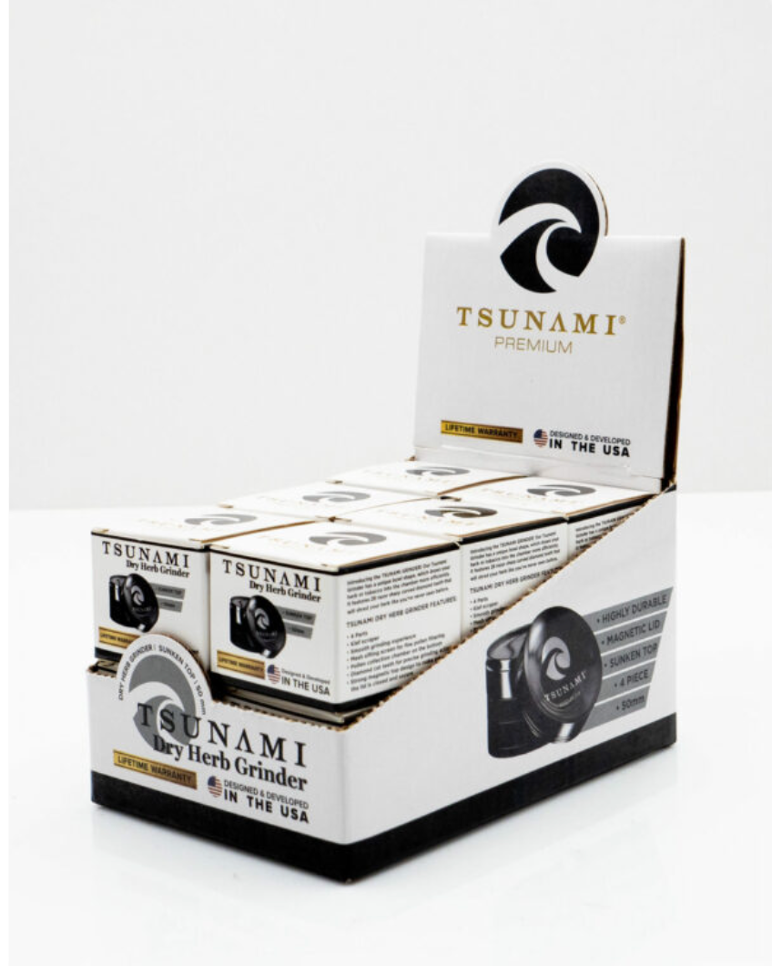 Angled view of the Tsunami 50mm Sunken Top Herb Grinder display box in black. This 4-piece dry herb grinder features a unique magnetic sunken lid designed to keep material centered for a clean, consistent grind.