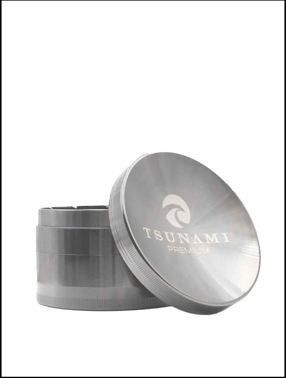 Front angled view of the Tsunami 50mm Sunken Top Herb Grinder in silver. This 4-piece dry herb grinder features a unique magnetic sunken lid designed to keep material centered for a clean, consistent grind.