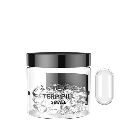 Front view of the White Rhino Terp Pill 50-count retail container in clear glass with a black lid. This bulk jar houses spinning quartz inserts designed to increase surface area and maximize vaporization efficiency inside bangers.