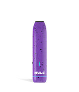 Front view of the Wulf LX Slim Dry Herb Vaporizer in purple with black splatter. This 900mAh handheld thermal extraction unit features an internal ceramic heating oven and four specific thermal outputs for precise material processing.