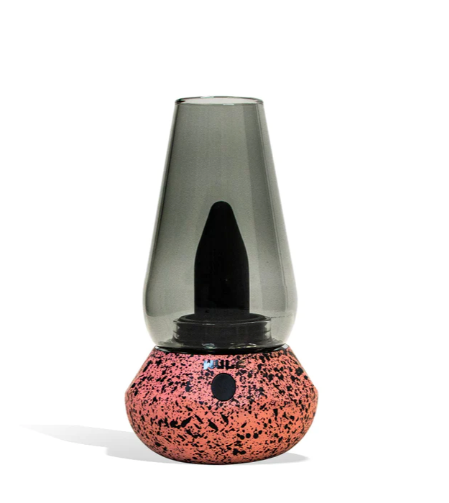 Side view of the Wulf Mods Fang 2-in-1 vaporizer in pink-black spatter. This compact desktop rig features an integrated LED light indicator that displays charging states and automatic session modes.