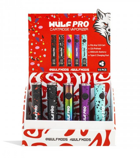 Angled overhead view of the Wulf Pro OLED 510 Battery 15-count retail display box showing a variety of assorted colors. This premium variable voltage vaporizer battery features a crisp OLED screen to monitor settings and comes perfectly packaged for smoke shop retail counters.