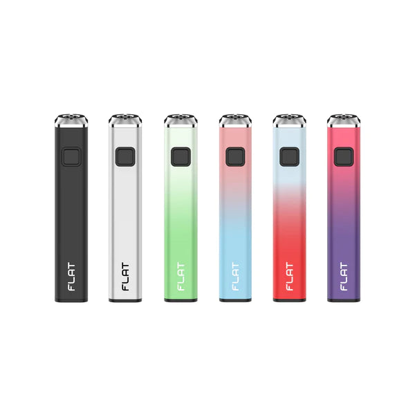 Angled overhead view of multiple Yocan Flat batteries spread out to show all the available color options side-by-side. This pocket-sized 510-thread vape battery features a unique roll-resistant square shape, preheat modes, and a universal fit for oil cartridges.