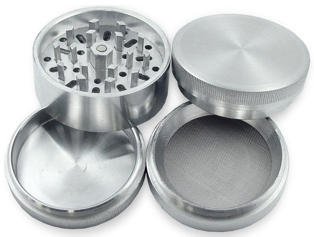 Angled overhead view of the 32mm aluminum grinder in black separated into its four core components. The versatile modular design features a magnetic lid, sharp grinding chamber, fine mesh pollen screen, and a bottom kief catcher to maximize your dry herb yield.
