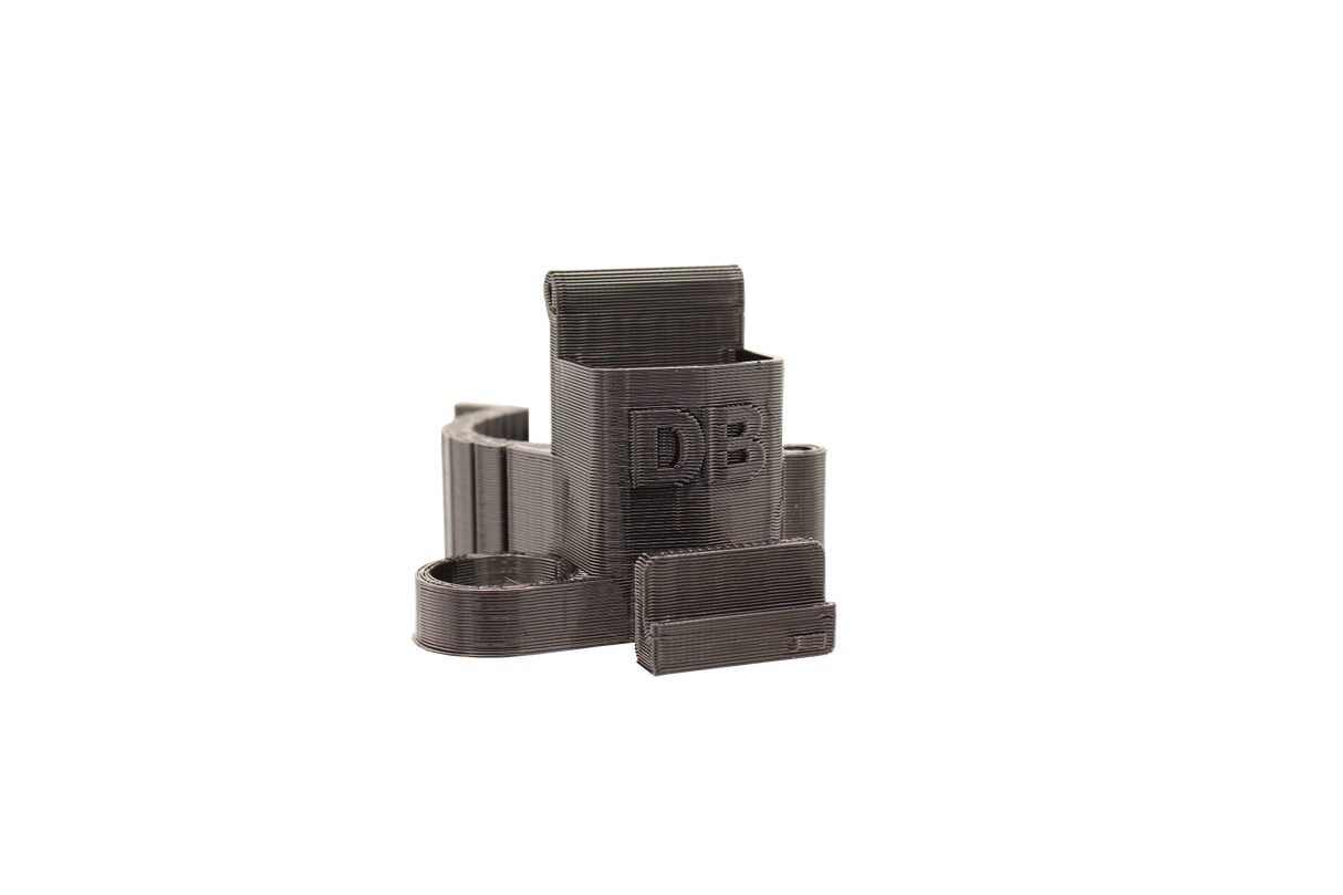 front view of the dabber box rig backpack clip in black. A organizational tool for holding lighters, dab tools or any other items that a smoker would need for their session.
