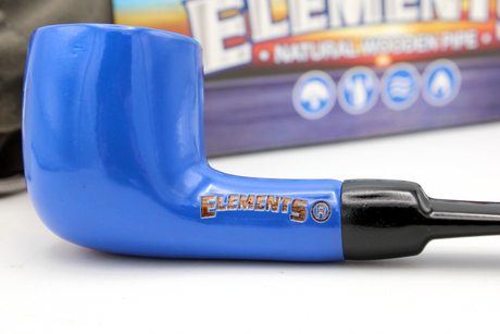close up view of the elements engraved metal pipe. A rugged pipe that is easy to clean and painted with their signature blue.