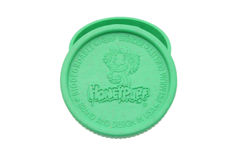 top view of the Honeypuff 56mm Biodegradable green hemp grinder. A eco friendly grinder that is durable while being compact for everyday use. 