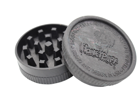 open view of the Honeypuff 56mm Biodegradable black hemp grinder. A eco friendly grinder that is durable while being compact for everyday use. 