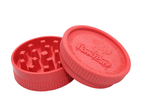 open side view of the Honeypuff 56mm Biodegradable red hemp grinder. A eco friendly grinder that is durable while being compact for everyday use. 