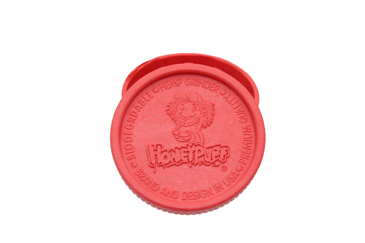 open top view of the Honeypuff 56mm Biodegradable red hemp grinder. A eco friendly grinder that is durable while being compact for everyday use. 