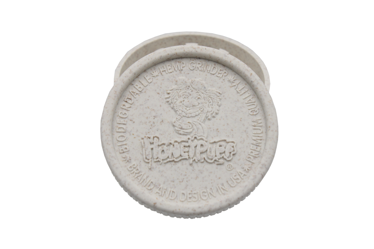 top view of the Honeypuff 56mm Biodegradable white hemp grinder. A eco friendly grinder that is durable while being compact for everyday use. 