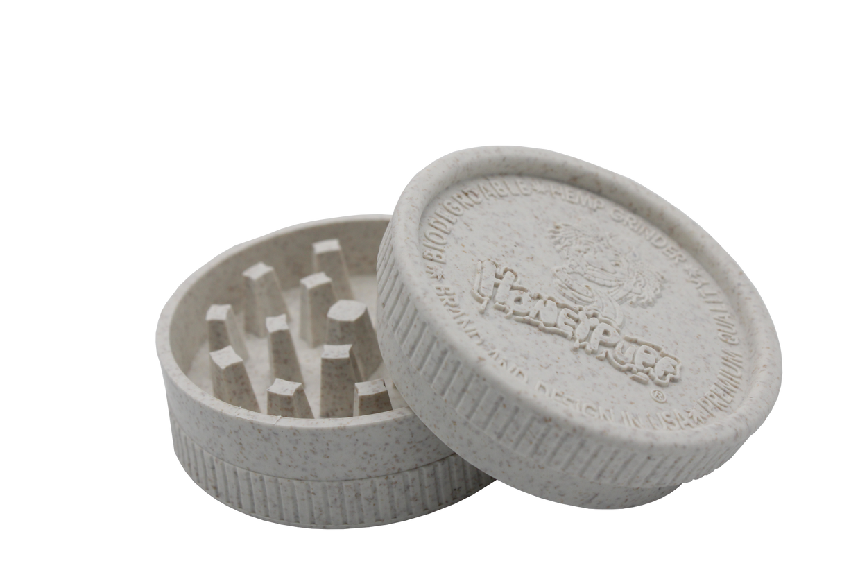 side openview of the Honeypuff 56mm Biodegradable green hemp grinder. A eco friendly grinder that is durable while being compact for everyday use.