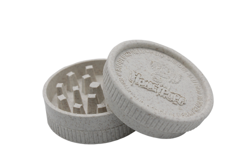 side openview of the Honeypuff 56mm Biodegradable green hemp grinder. A eco friendly grinder that is durable while being compact for everyday use.
