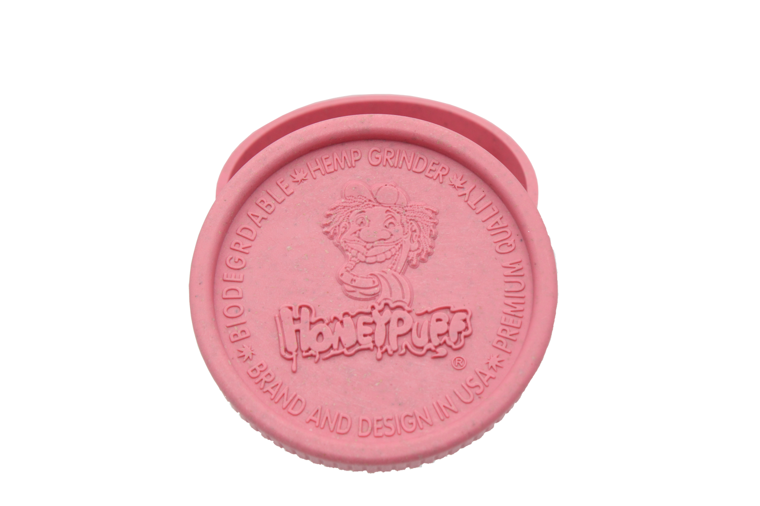 top view of the Honeypuff 56mm Biodegradable pink hemp grinder. A eco friendly grinder that is durable while being compact for everyday use. 