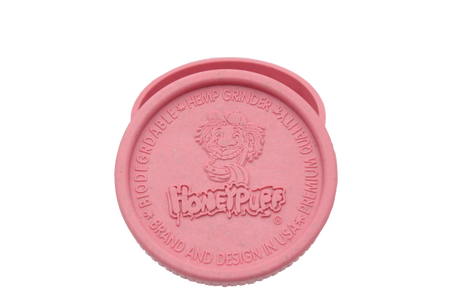 top view of the Honeypuff 56mm Biodegradable pink hemp grinder. A eco friendly grinder that is durable while being compact for everyday use. 