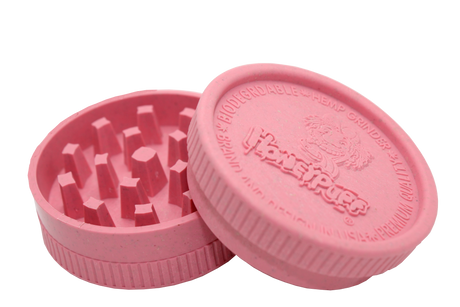 side open view of the Honeypuff 56mm Biodegradable pink hemp grinder. A eco friendly grinder that is durable while being compact for everyday use. 