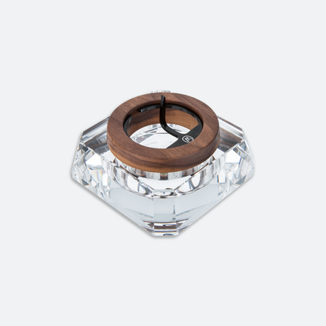 full view of the marley natural crystal ash tray. A clear and dark oak ashtray with poker and padded bottom.