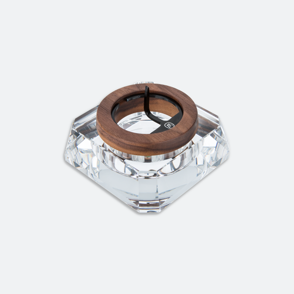 full view of the marley natural crystal ash tray. A clear and dark oak ashtray with poker and padded bottom.