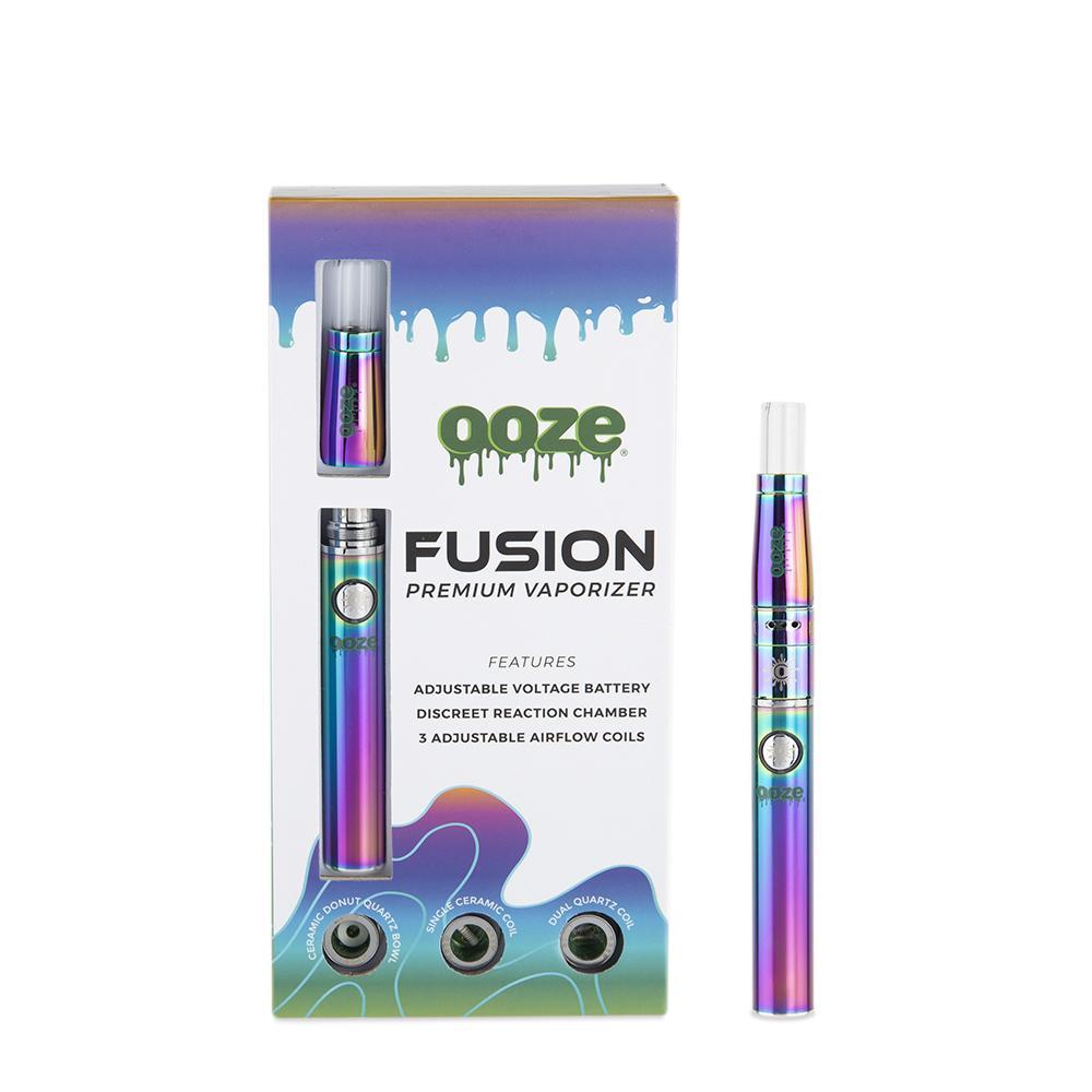 front view of the ooze fusion product and package in a titanium anodized finish. A product built for multiple concentrate experiences with three interchangeable coils for different flavor profiles.