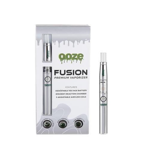 front view of the ooze fusion product and package in a silver finish. A product built with three interchangeable coils for different flavor profiles for any preference.