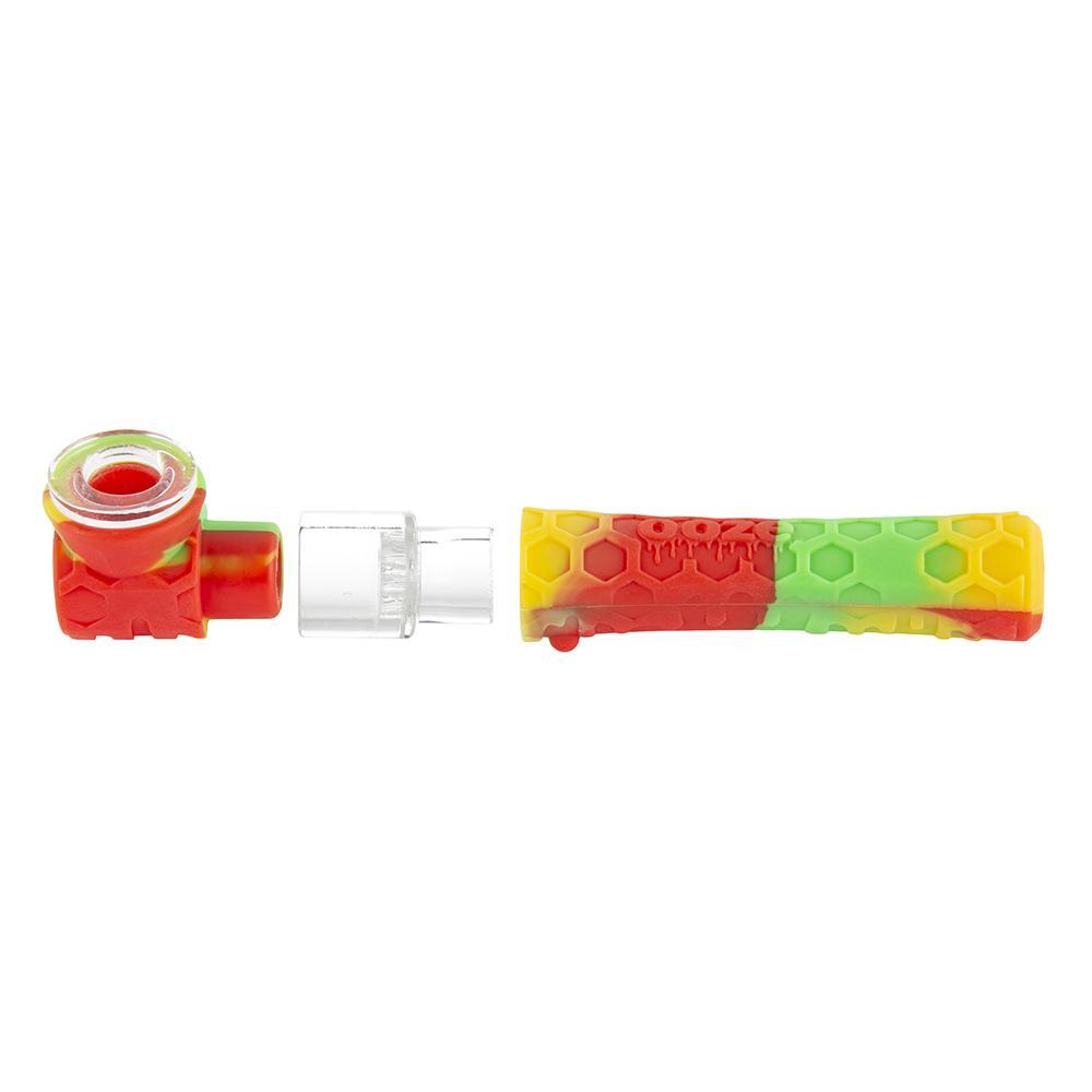 exploded view of the Ooze pipper in the rasta colors of red, green, and yellow. A hybrid chillum one hitter with glass bowl. For those who want quick and portable hits on the go.