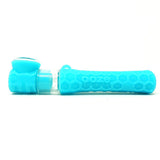 profile view of the Ooze Pipper in a bright teal. A hybrid chillum made from silicone with glass bowl. convenient product for low profile hits.