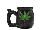 side view of the ceramic mug with build in hand pipe. Made with a matte black finish.