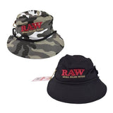 front view of the RAW Smokerman's bucket hat in both camo and black. An official apparel item with storage areas for cones or poker tools.