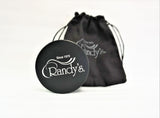 View of the Randy's 63mm Revolution Grinder and storage bag. A quality herb grinder from the Randy's brand