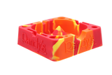 angle view of the Randy's 7" ashtray. A heat resistant and durable ash tray with storage compartments and a debowler spike in the center for ease of cleaning. casted in red yellow and orange colors